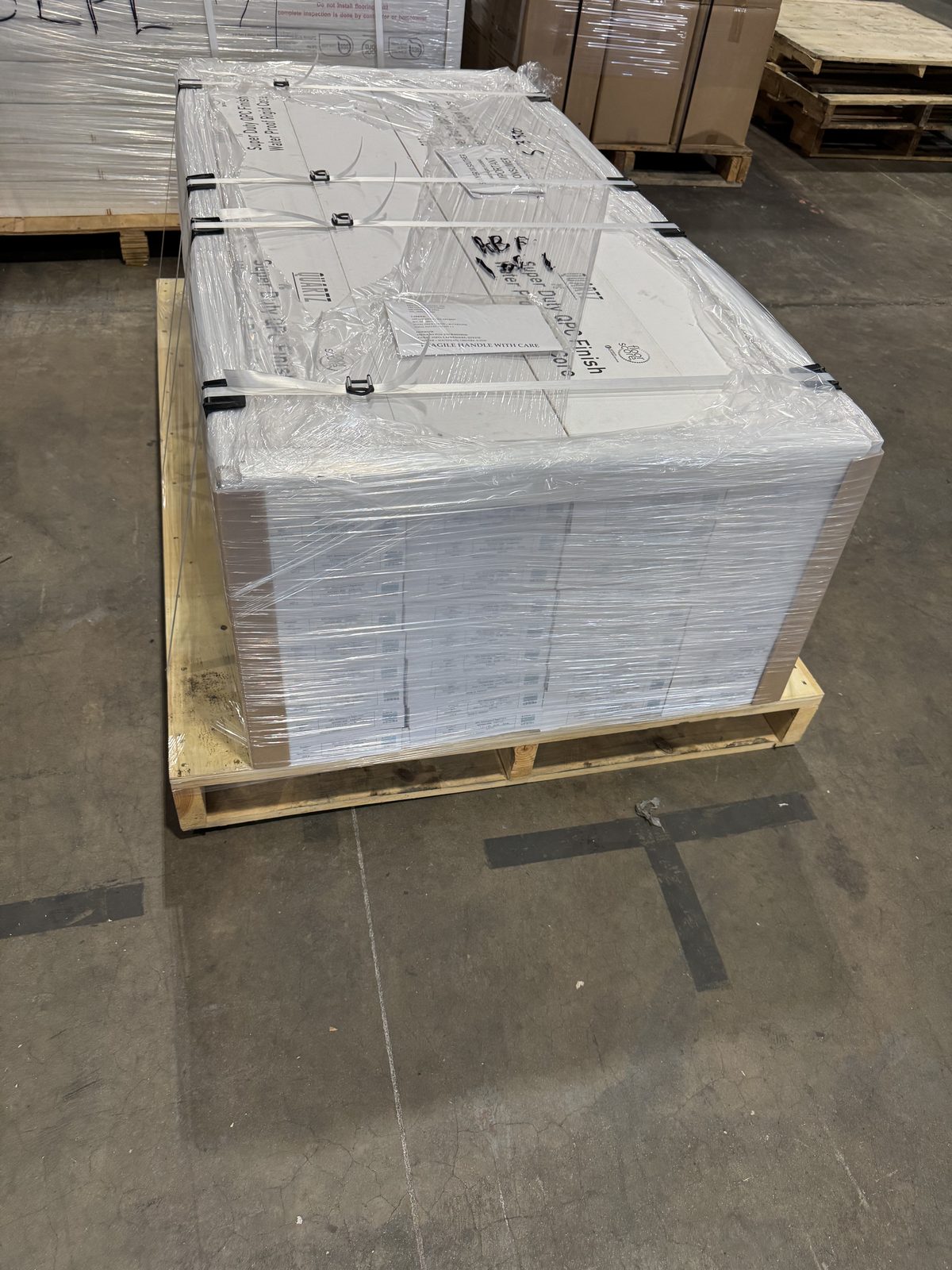 Palletized freight staged on a warehouse dock ready for outbound delivery